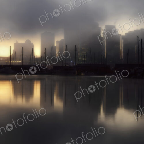The view from Stanley Park in the early morning with mist rising from the water,… The view from Stanley Park in the early morning with mist rising from the water,…