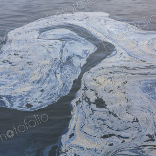 The view from above of a layer of oil, a slick on the waters of Puget Sound. The view from above of a layer of oil, a slick on the waters of Puget Sound.
