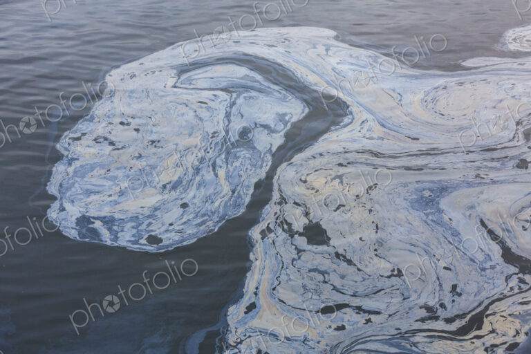 The view from above of a layer of oil, a slick on the waters of Puget Sound.