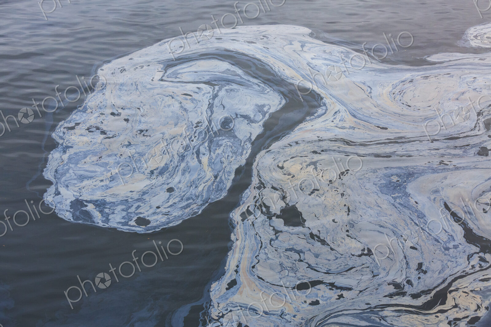The view from above of a layer of oil, a slick on the waters of Puget Sound.