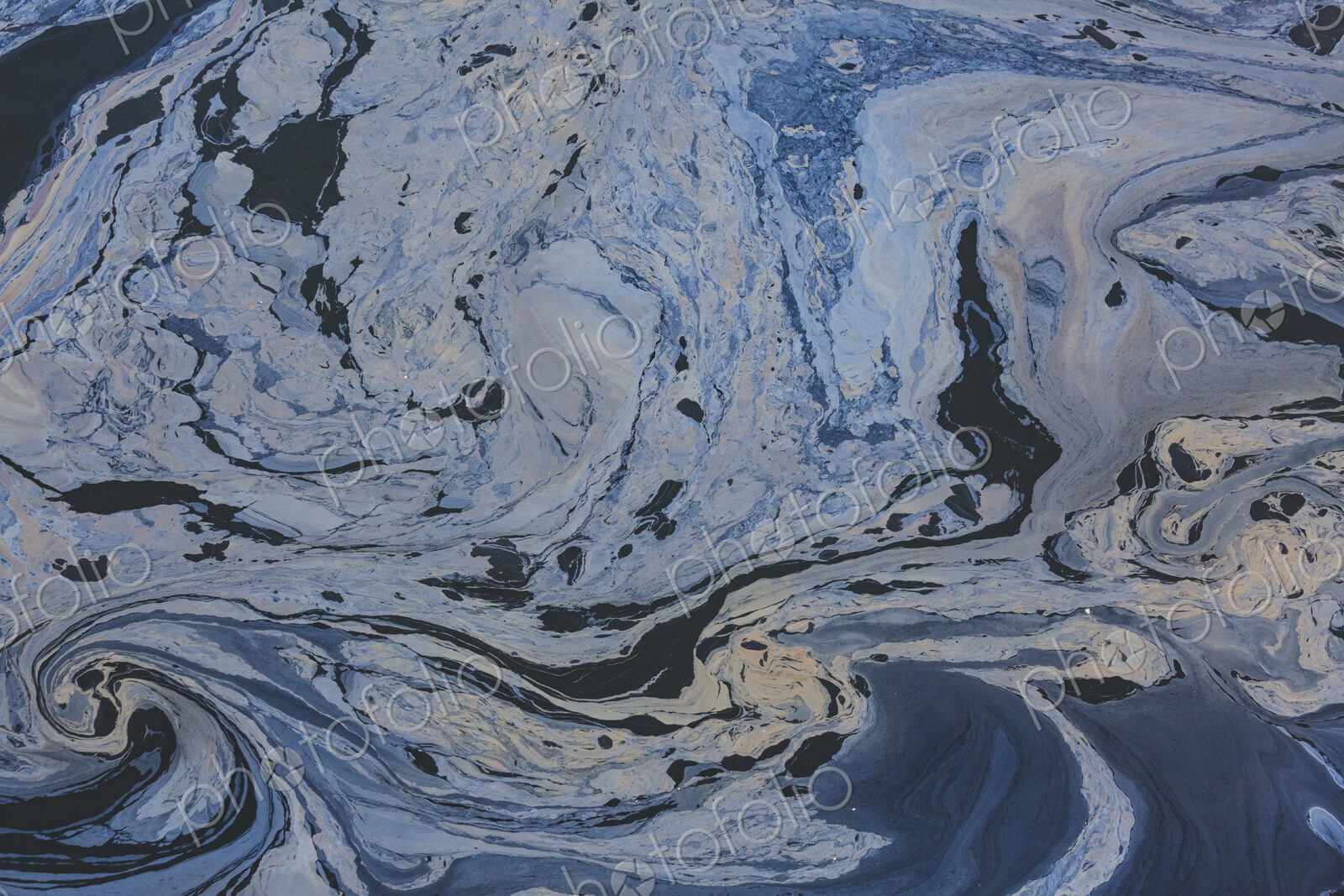 The view from above of a layer of oil, a slick on the waters of Puget Sound.