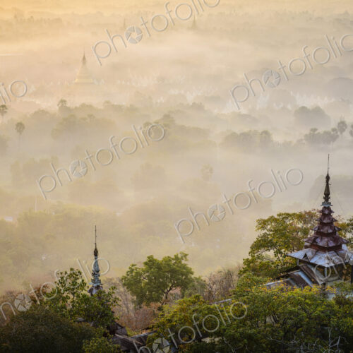 The view over the plain of temples, stupas rising from the mist, lakes and woodland. The view over the plain of temples, stupas rising from the mist, lakes and woodland.