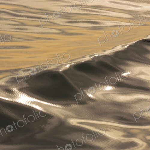 The water surface, ripples and reflections and shadows at dusk. The water surface, ripples and reflections and shadows at dusk.