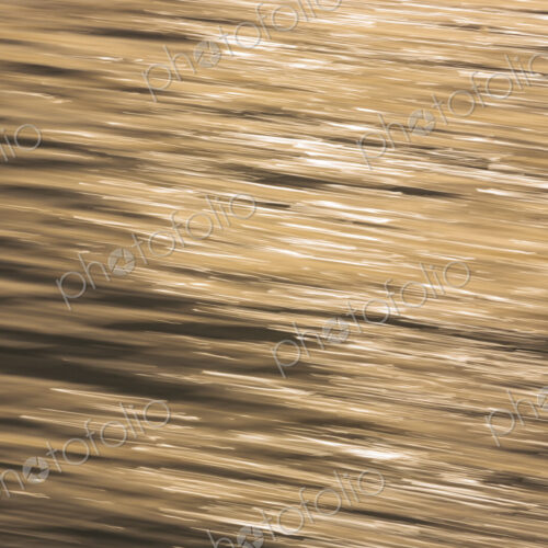 The water surface, ripples and reflections and shadows at dusk. The water surface, ripples and reflections and shadows at dusk.
