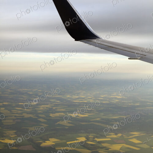 The winglet or wing tip of an aircraft viewed from the passenger window. The winglet or wing tip of an aircraft viewed from the passenger window.