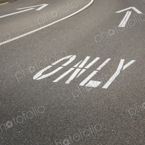 This way only road, Ahead Only, the word Only with arrow symbol. This way only road, Ahead Only, the word Only with arrow symbol.