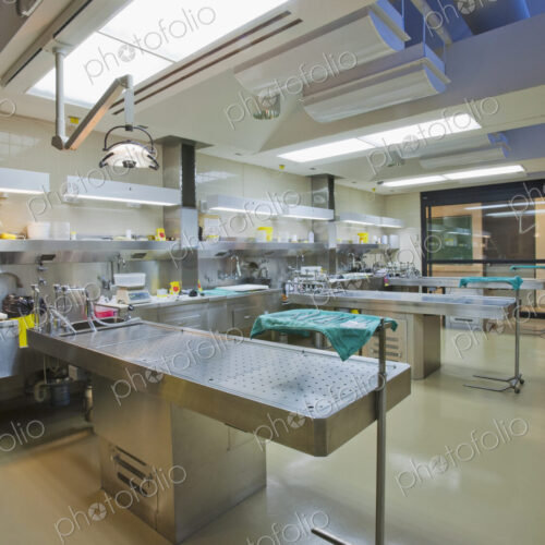 Three autopsy tables at a morgue.