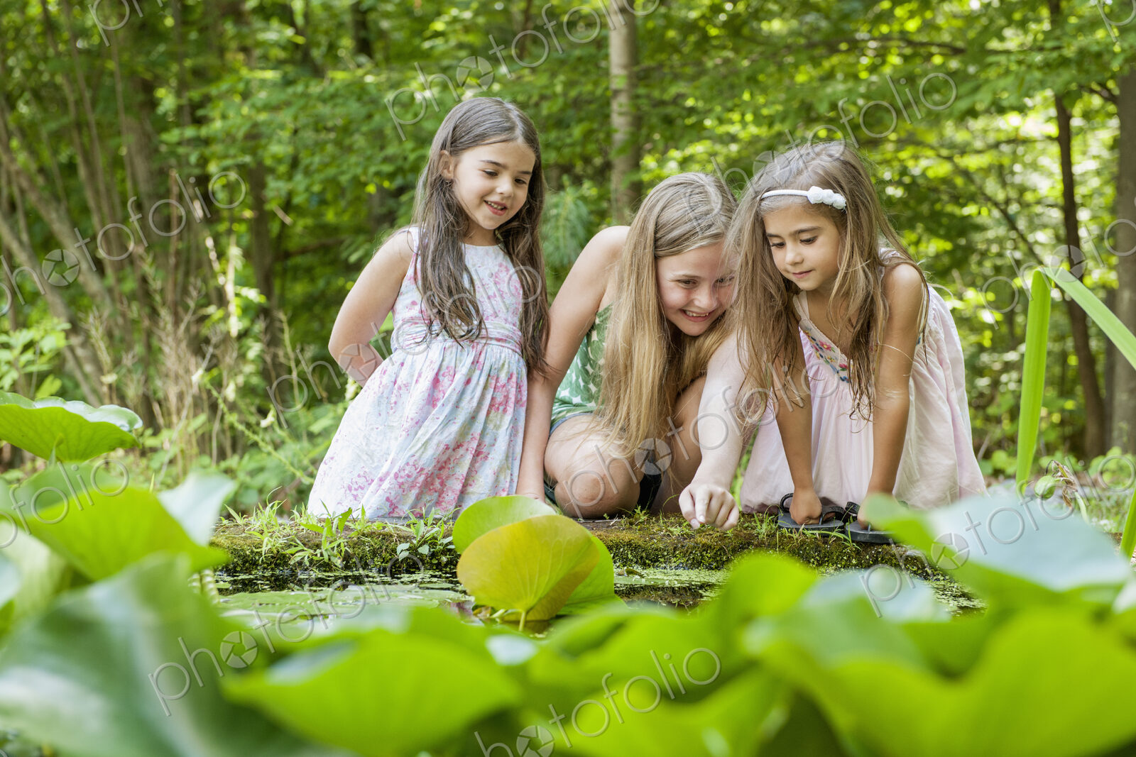 Three girls playing outdoors.
