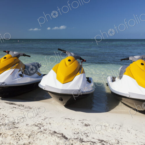 Three jet skis on the beach Three jet skis on the beach