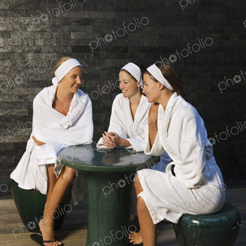 Three women seated in a health spa