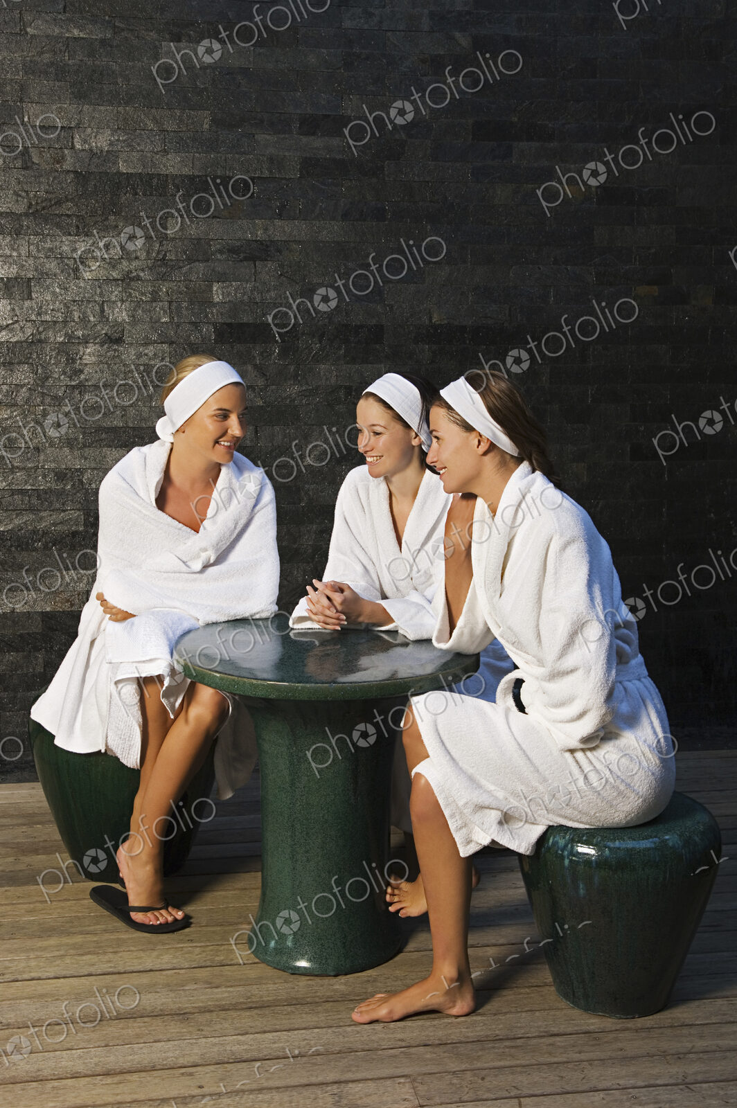 Three women seated in a health spa