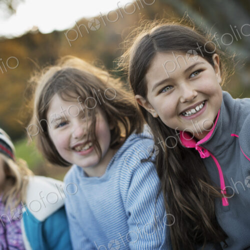 Three young girls, children, outside in the fresh air. Autumn foliage. Three young girls, children, outside in the fresh air. Autumn foliage.