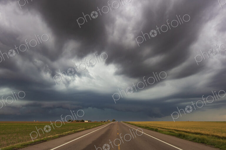 Thunderstorm with Mesocyclone along Colorado Highway 14, grey and black clouds…