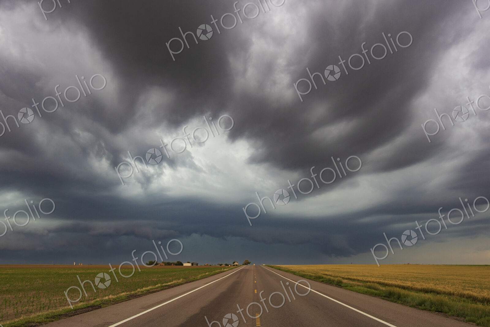 Thunderstorm with Mesocyclone along Colorado Highway 14, grey and black clouds…