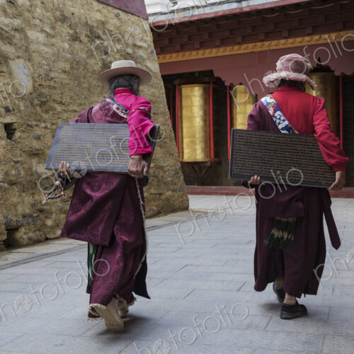 Tibetan Women Carrying inscribed Tablets to be Built into a Mani Wall Tagong, Sichuan… Tibetan Women Carrying inscribed Tablets to be Built into a Mani Wall Tagong, Sichuan…