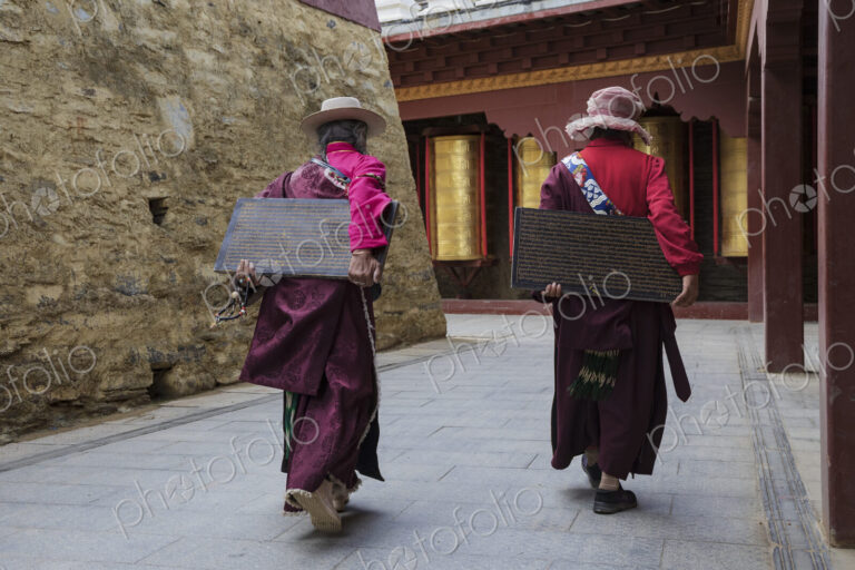 Tibetan Women Carrying inscribed Tablets to be Built into a Mani Wall Tagong, Sichuan…