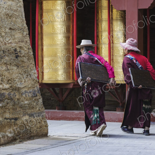 Tibetan Women Carrying inscribed Tablets to be Built into a Mani Wall Tagong, Sichuan… Tibetan Women Carrying inscribed Tablets to be Built into a Mani Wall Tagong, Sichuan…