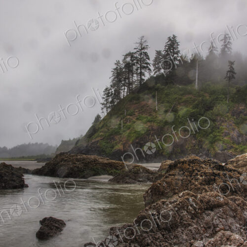Tide pools in cloudy rural landscape.