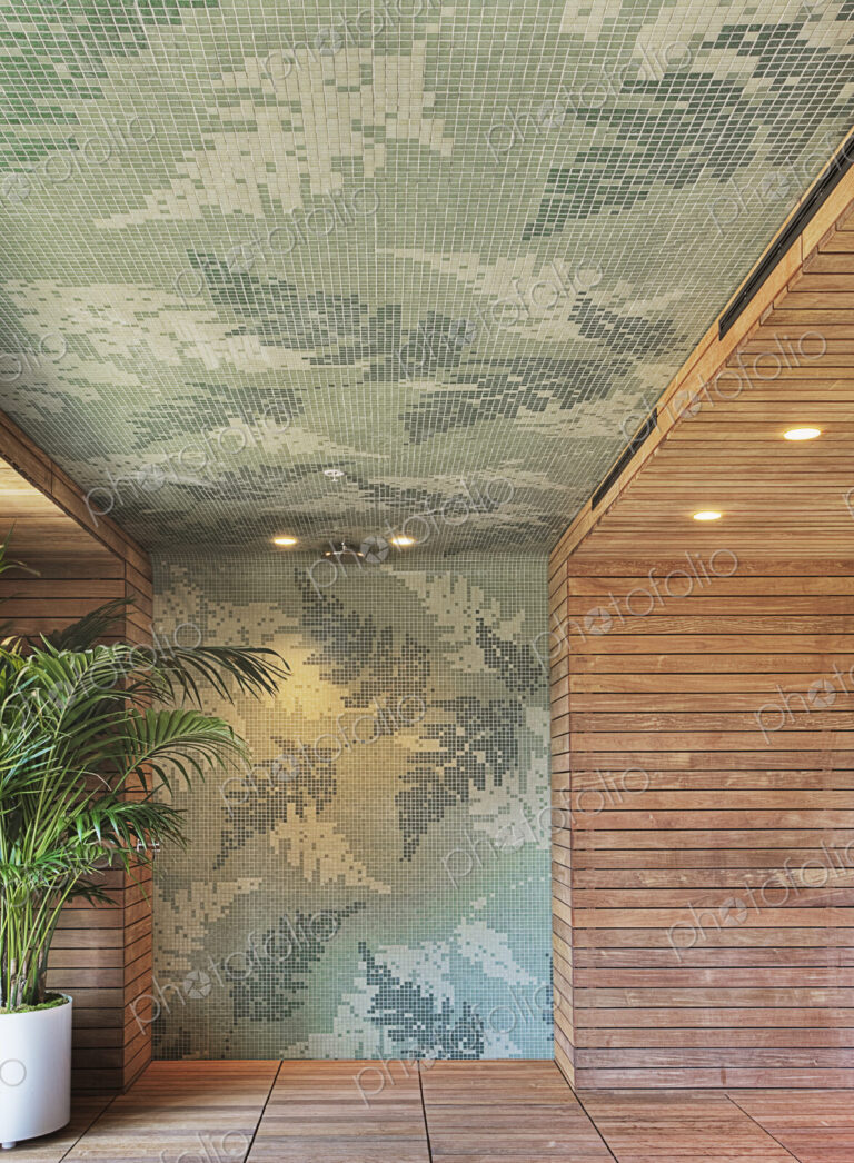 Tiled and wooden wall in shower with potted plant.