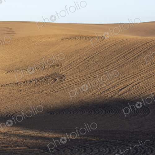 Tilled farmland and rolling hills Tilled farmland and rolling hills