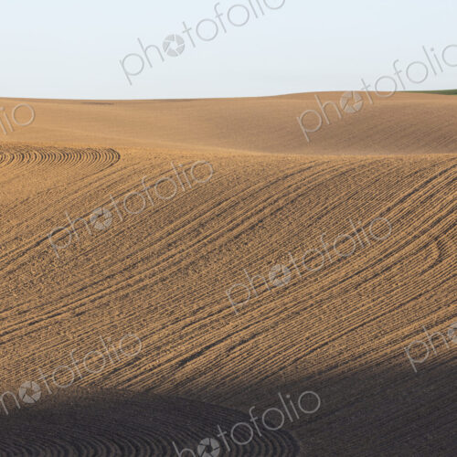 Tilled farmland and rolling hills Tilled farmland and rolling hills