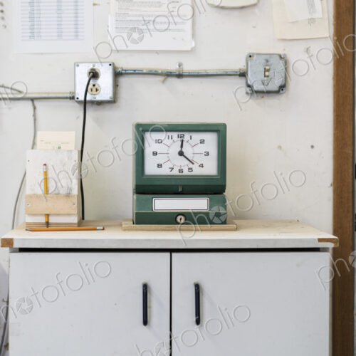 Timeclock used to check in employees in a woodworking factory. Timeclock used to check in employees in a woodworking factory.