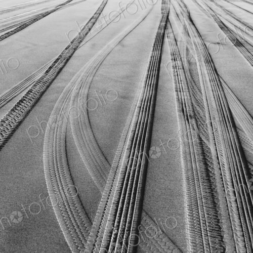 Tire tracks on the soft surface of sand on a beach. Tire tracks on the soft surface of sand on a beach.