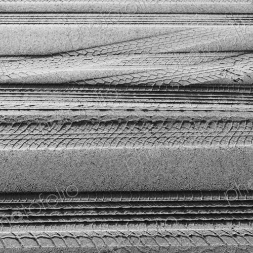 Tire tracks on the soft surface of sand on a beach. Tire tracks on the soft surface of sand on a beach.