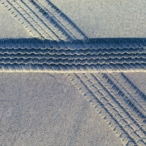 Tire tracks on the soft surface of sand on a beach. Tire tracks on the soft surface of sand on a beach.