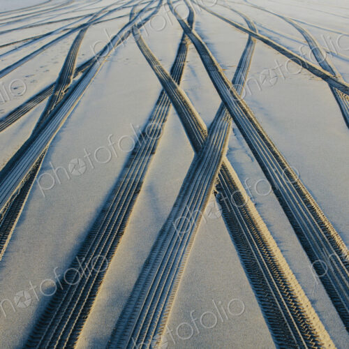 Tire tracks on the soft surface of sand on a beach. Tire tracks on the soft surface of sand on a beach.