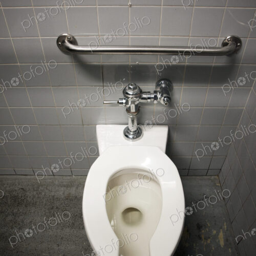 Toilet Bowl in a Tiled Restroom Toilet Bowl in a Tiled Restroom