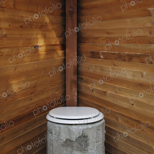 Toilet in wooden stall