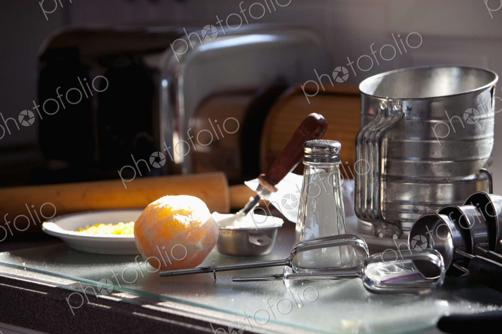 Tools and ingredients for baking on a domestic kitchen counter