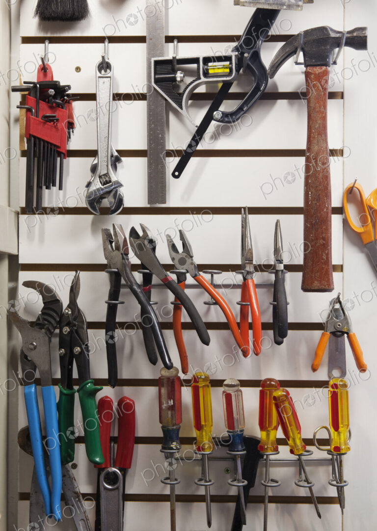 Tools on a rack in a workshop.