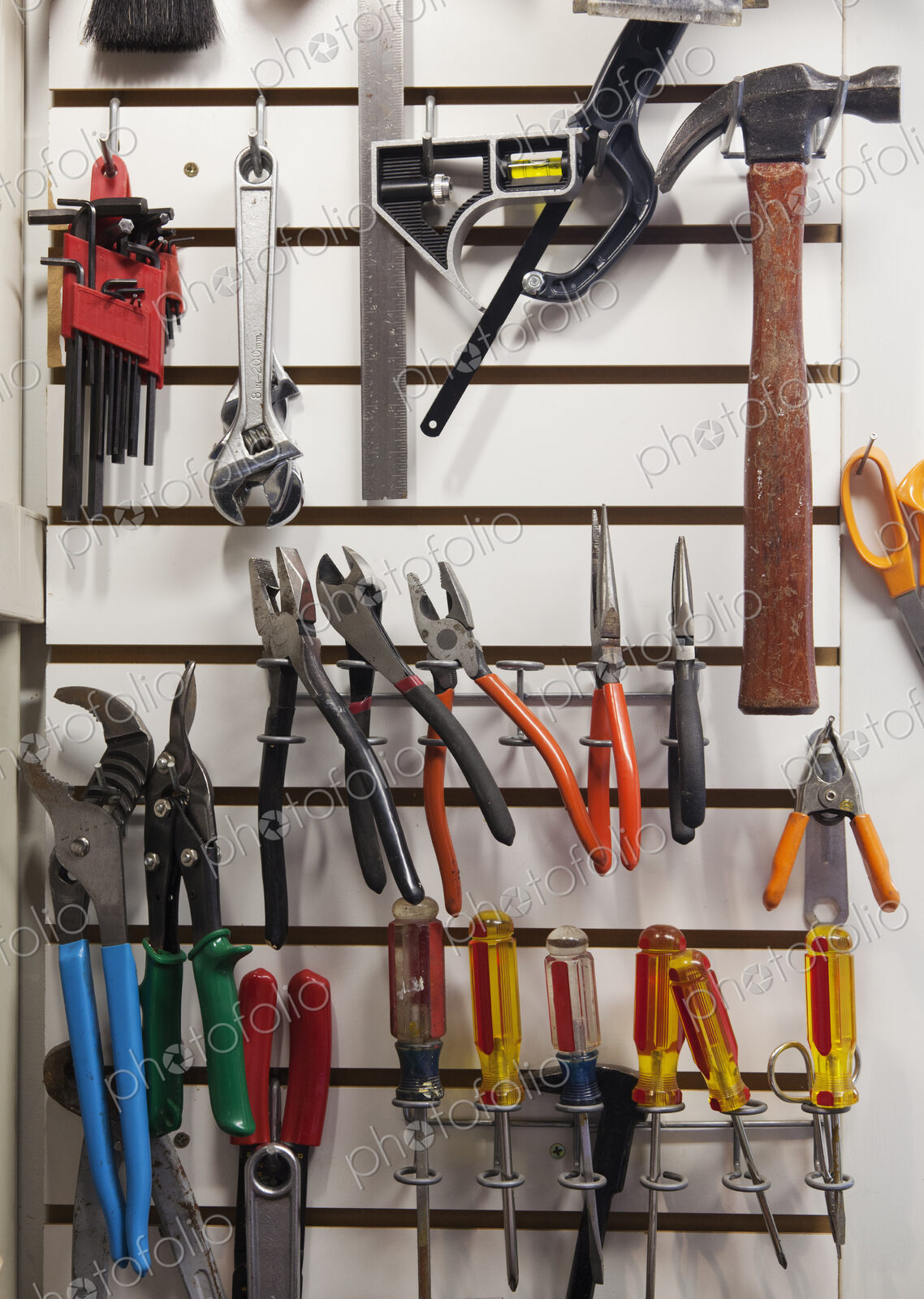 Tools on a rack in a workshop.