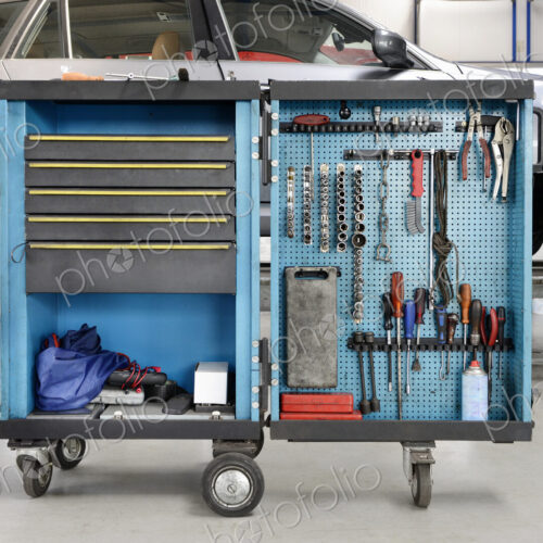 Tools on a trolley,organised in rows,at an auto repair shop. Tools on a trolley,organised in rows,at an auto repair shop.