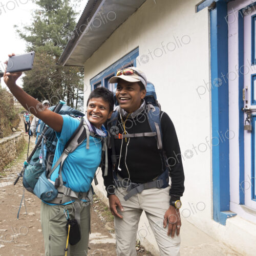 Tourists posing for cell phone selfie Tourists posing for cell phone selfie