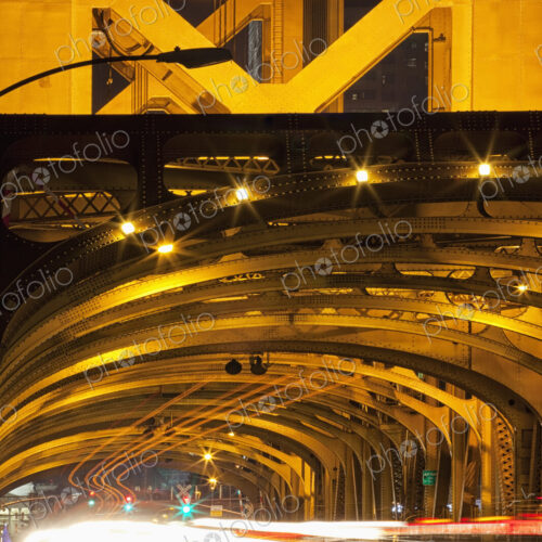 Tower Bridge at night, the roadway across the bridge with curved arches and the… Tower Bridge at night, the roadway across the bridge with curved arches and the…