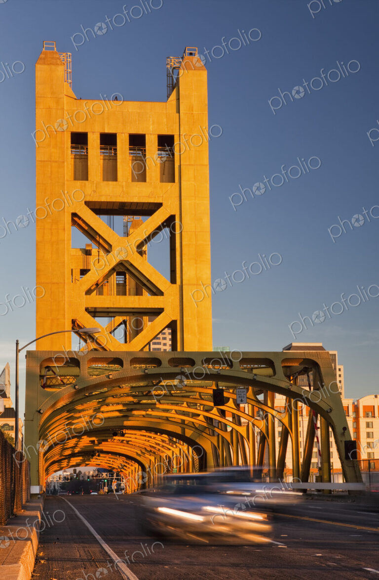Tower Bridge at sunset, Sacramento river road bridge, tall towers and rows of arches…