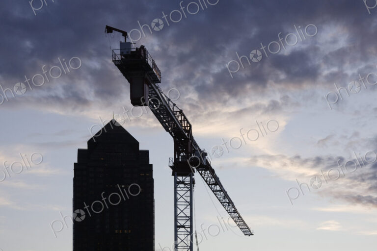 Tower Crane with Building Silhouette in Background