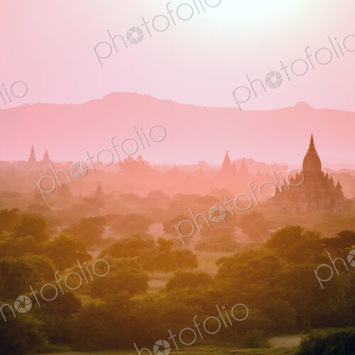 Towers in misty landscape