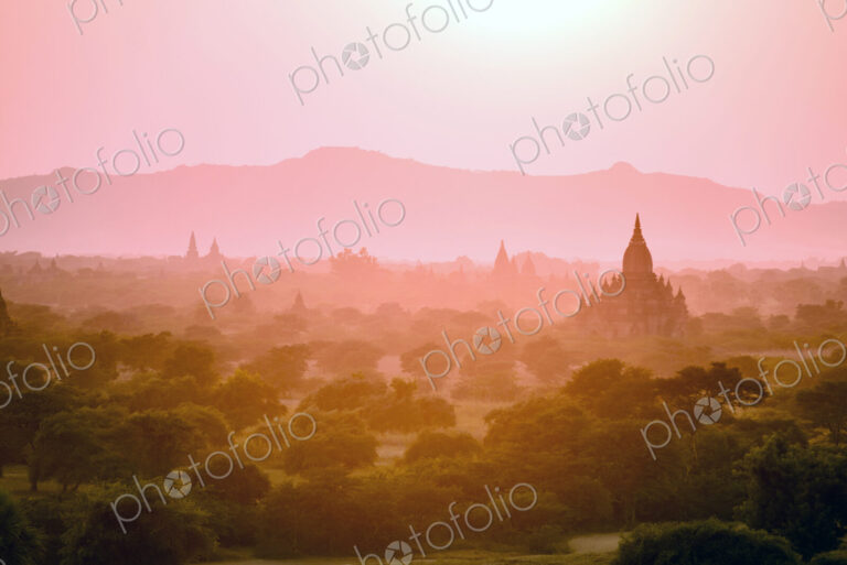 Towers in misty landscape