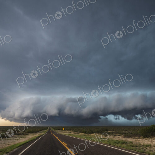 Tracking a Supercell alomg Texas Highway 285, grey cloud formations hovering over the… Tracking a Supercell alomg Texas Highway 285, grey cloud formations hovering over the…