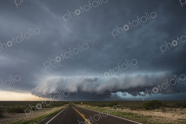 Tracking a Supercell alomg Texas Highway 285, grey cloud formations hovering over the…