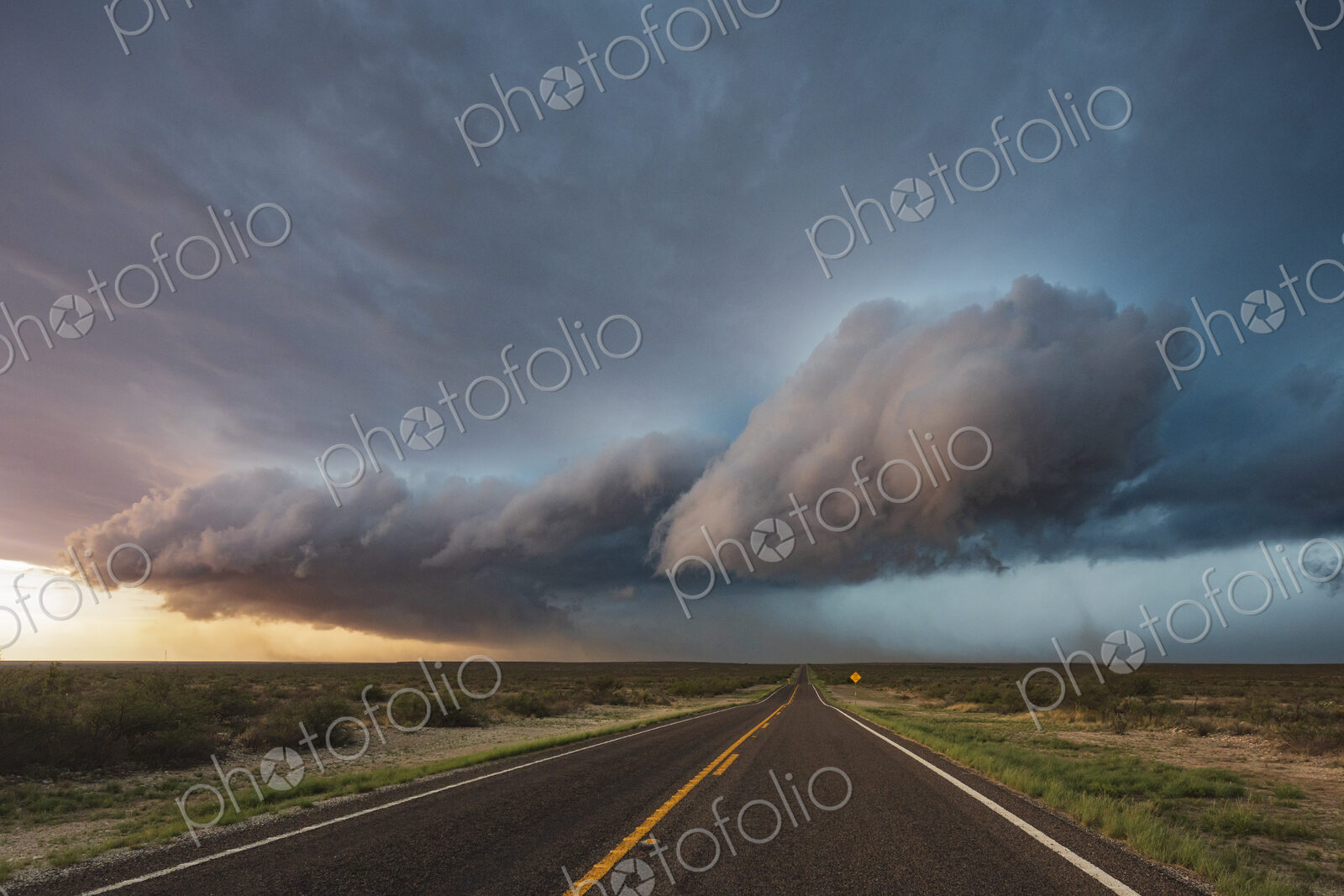 Tracking a Supercell alomg Texas Highway 285, grey cloud formations hovering over the…