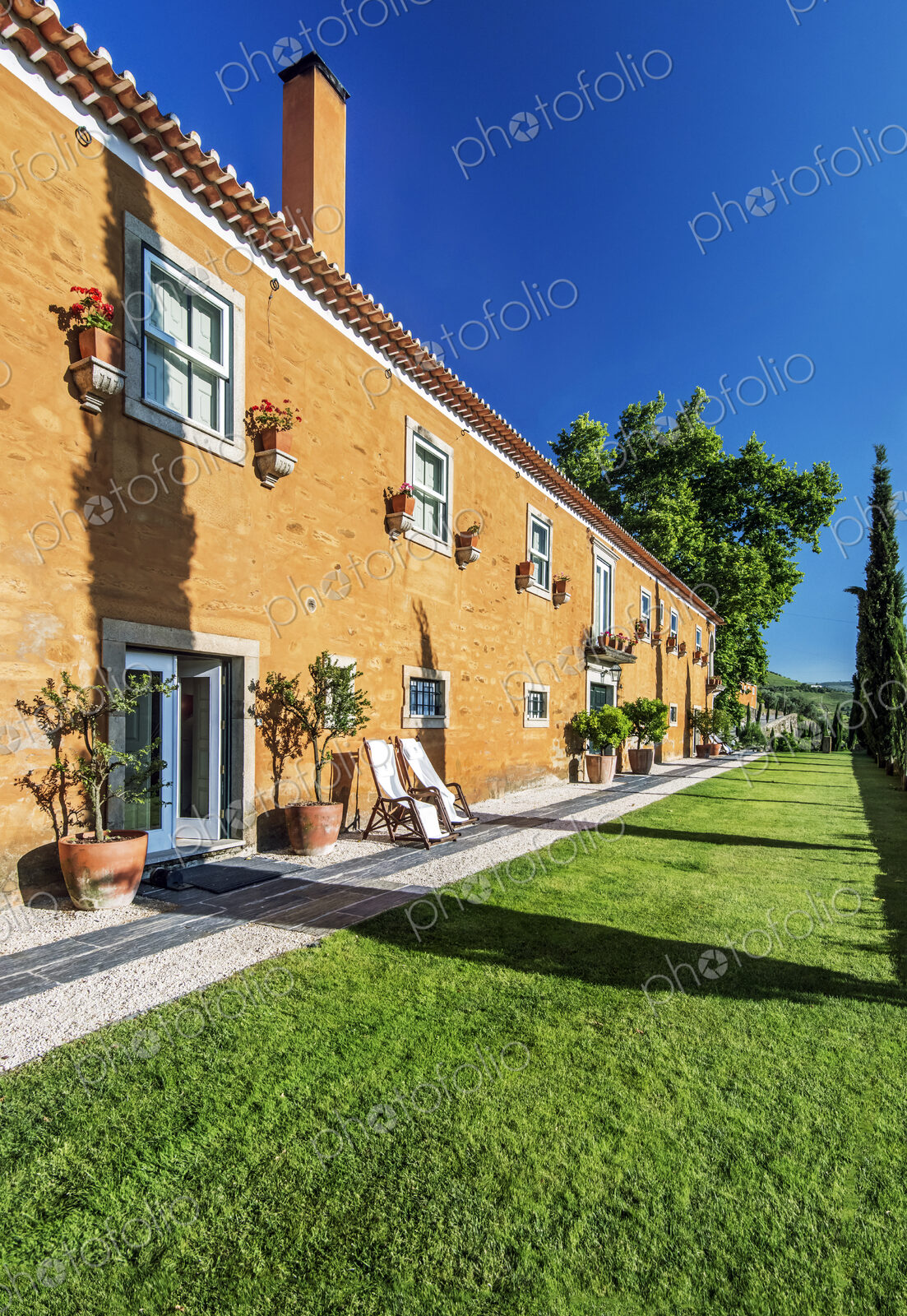 Traditional hotel and grass walkway