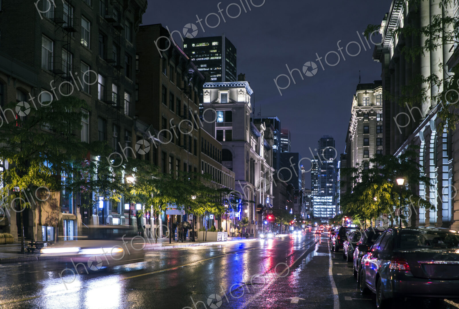 Traffic in wet cityscape at night
