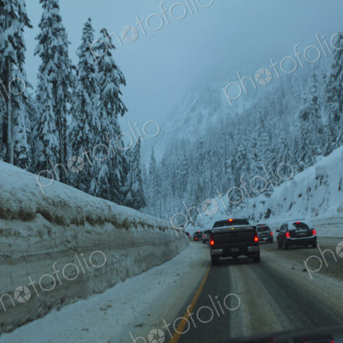 Traffic jam of cars on snowy Interstate 90 near Snoqualmie Pass, WA USA