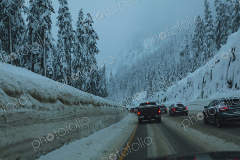 Traffic jam of cars on snowy Interstate 90 near Snoqualmie Pass, WA USA