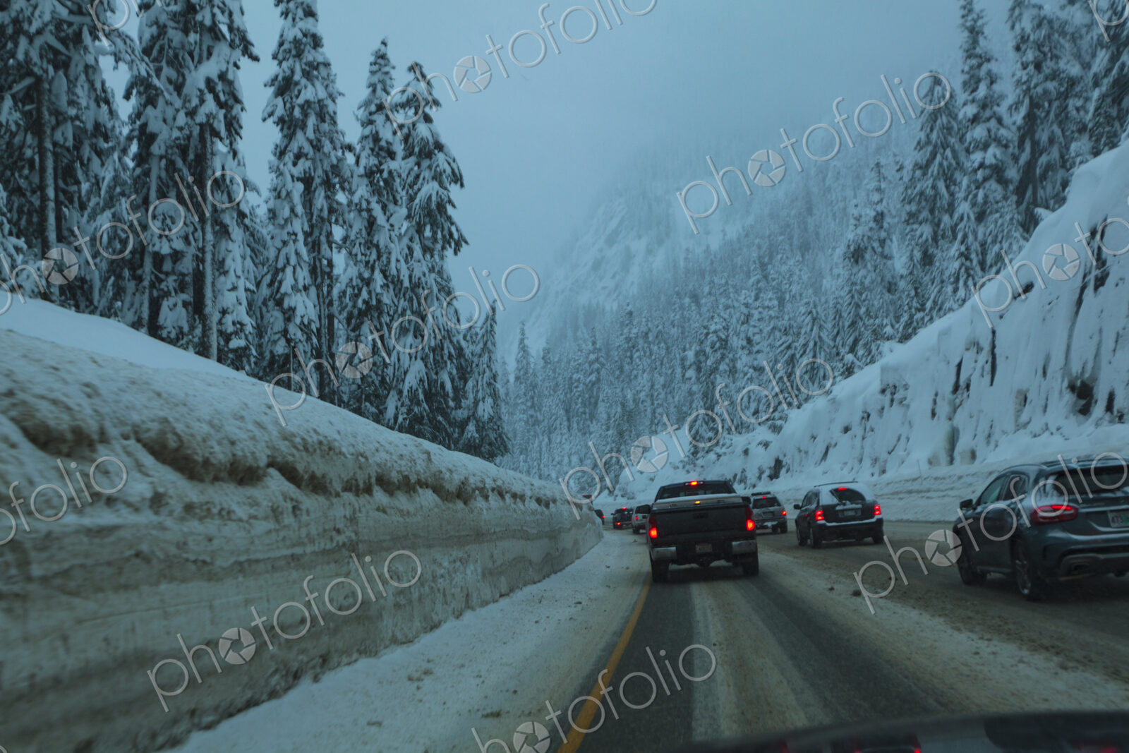 Traffic jam of cars on snowy Interstate 90 near Snoqualmie Pass, WA USA
